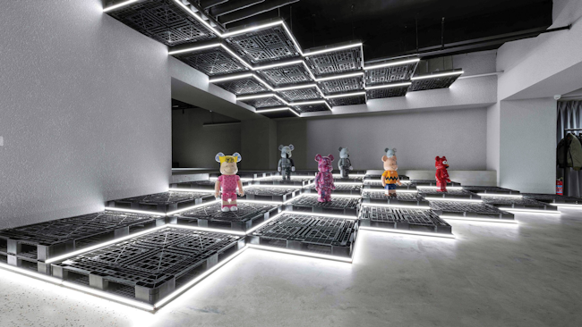 A lesson in melding retail and art, the experiential space—part retail, part art gallery—can display menswear one day, and then change it out completely to exhibit pop art, such as collectible Be@rbrick figurines, seen here, the very next day.