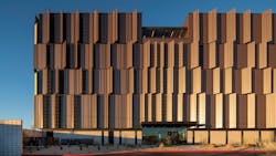 The west façade of the Pinal County Attorney's Office features a perforated metal panel. The west façade of the Pinal County Attorney's Office features a perforated metal panel.