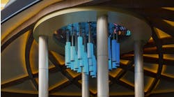 Four 34-foot round columns with light champagne column covers in the Current pattern style flank, and complement, a water feature at the entrance of the Sahara Casino.