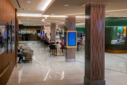 High-traffic pedestrian pathways in the hotel feature five custom square column covers in Móz Classic Khaki with a Coarse grain measuring 30 in. in diameter and 16 feet tall. High-traffic pedestrian pathways in the hotel feature five custom square column covers in Móz Classic Khaki with a Coarse grain measuring 30 in. in diameter and 16 feet tall.
