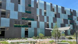 Compression-Clipped Glass Parking Façade System Compression-Clipped Glass Parking Façade System
