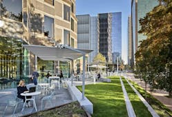 The 1.4-acre plaza around Trammell Crow Center in Dallas has been transformed by converting a closed-off garden into an open and welcoming space. The plaza provides lots of shade, a large green space for events, and a social workspace with dining and seating.