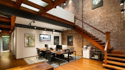 A historic townhouse is converted into an office environment with hints of residential design. A historic townhouse is converted into an office environment with hints of residential design.