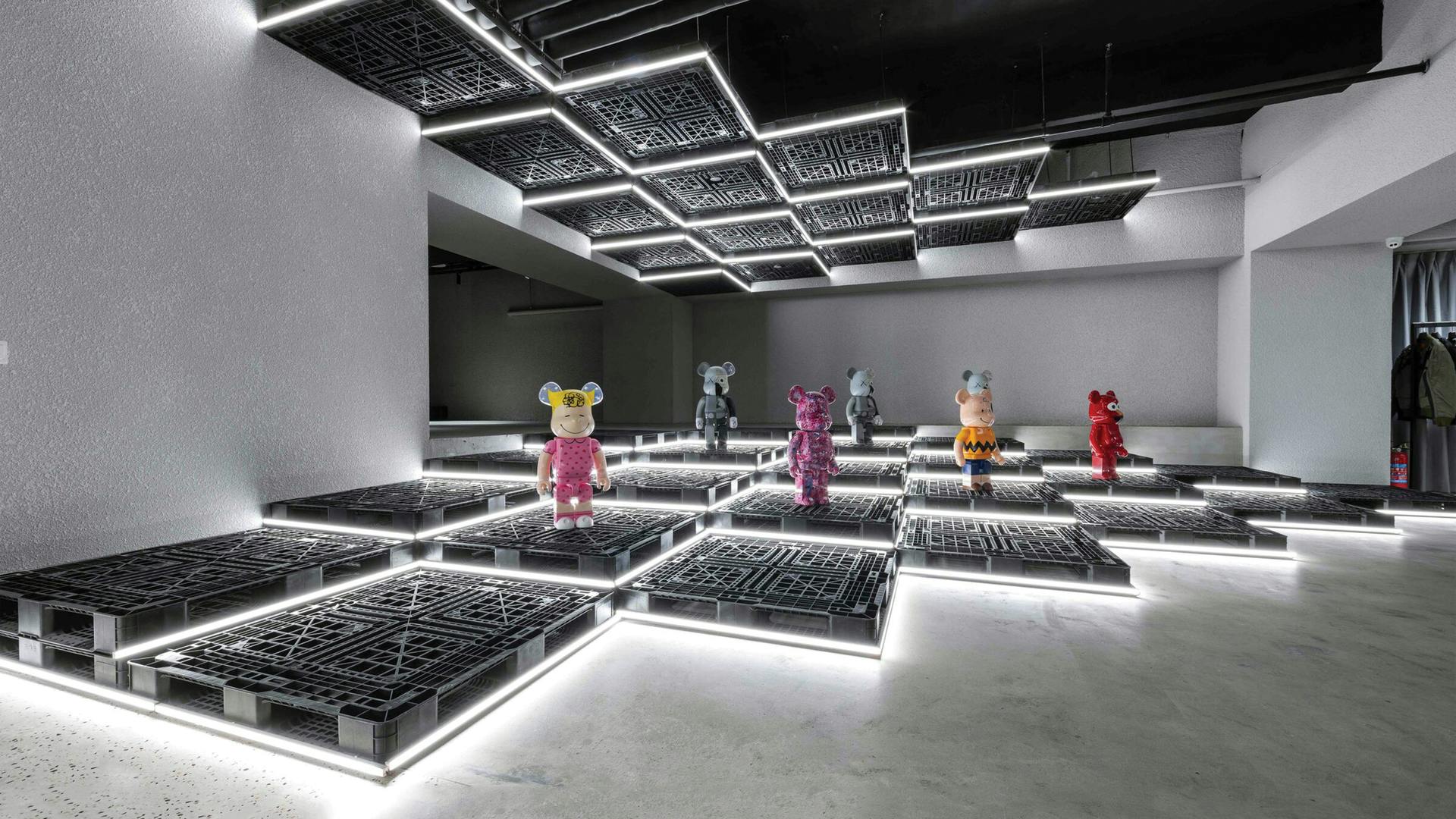 A lesson in melding retail and art, the experiential space&mdash;part retail, part art gallery&mdash;can display menswear one day, and then change it out completely to exhibit pop art, such as collectible Be@rbrick figurines, seen here, the very next day.