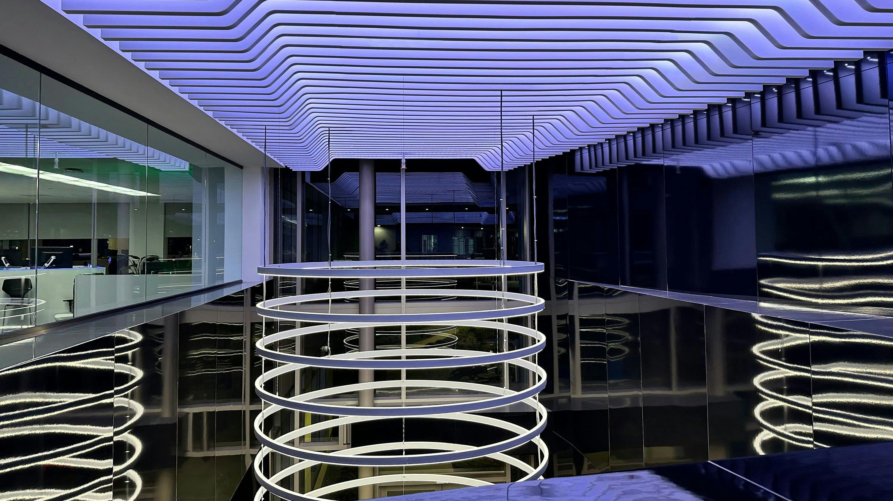 The DIMM-shaped ceiling-mounted sculpture includes LED lights and custom linear baffles.
