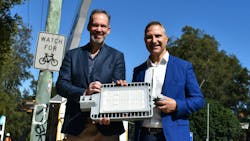 Marc England, Ausgrid's CEO, and Cr John Faker, SSROC's president, show the street lighting luminaire. Marc England, Ausgrid's CEO, and Cr John Faker, SSROC's president, show the street lighting luminaire.