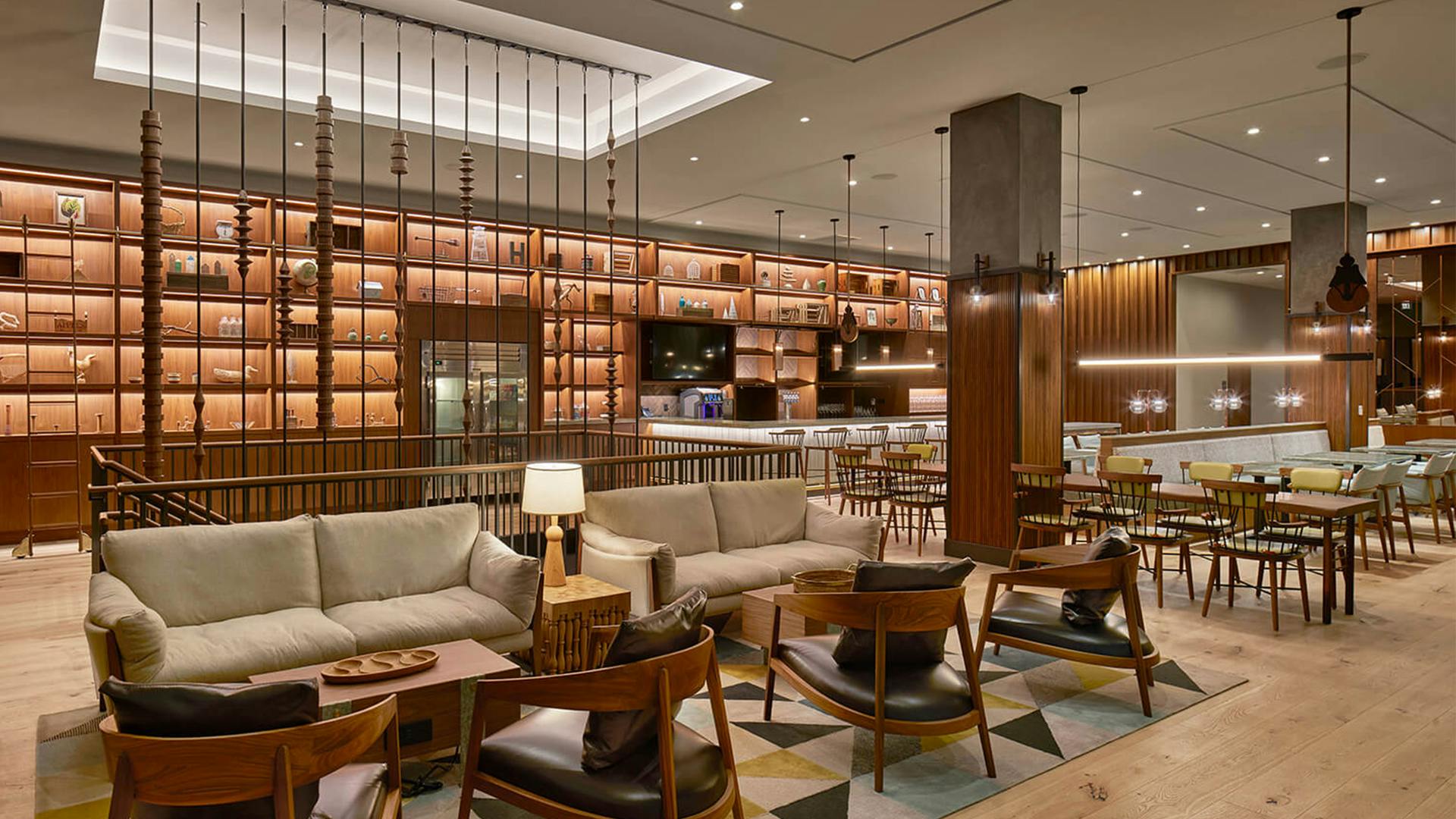 The coffered ceiling highlights the modern spindle staircase. Reminiscent of a skylight, it is illuminated by LED tape light concealed in the architectural ceiling cove.