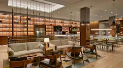 The coffered ceiling highlights the modern spindle staircase. Reminiscent of a skylight, it is illuminated by LED tape light concealed in the architectural ceiling cove.