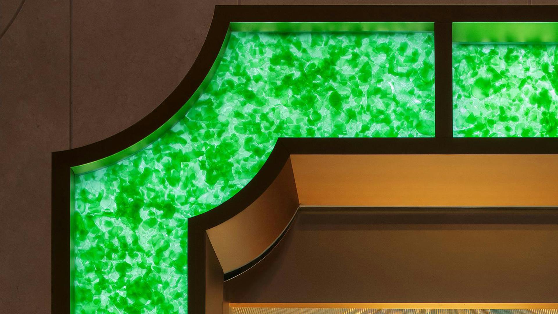 Recycled glass bottles create a unique material effect on the facade of the flagship Bulgari store in Shanghai.