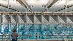 View south toward the interior face of the concrete fin walls, Eastside Recreation Center natatorium, in El Paso, Texas, designed by Perkins&Will View south toward the interior face of the concrete fin walls, Eastside Recreation Center natatorium, in El Paso, Texas, designed by Perkins&Will