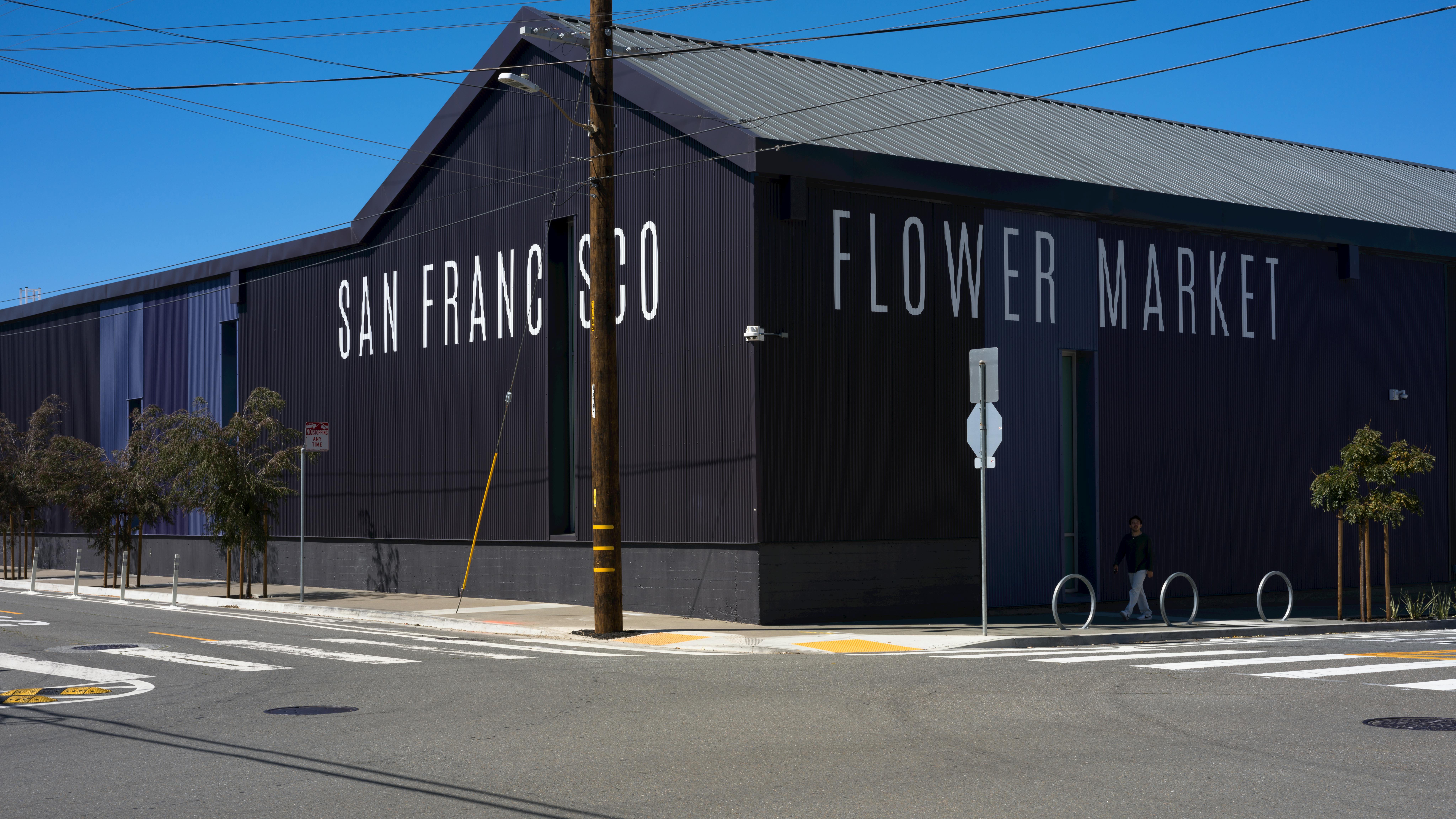 The new San Francisco Flower Market building united five older disparate buildings behind a vibrant, metal panel exterior.