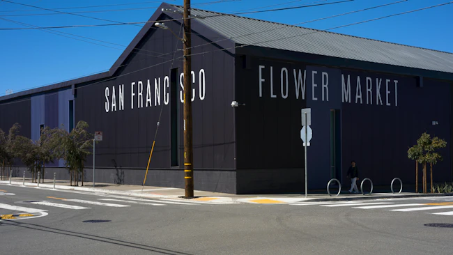 The new San Francisco Flower Market building united five older disparate buildings behind a vibrant, metal panel exterior.