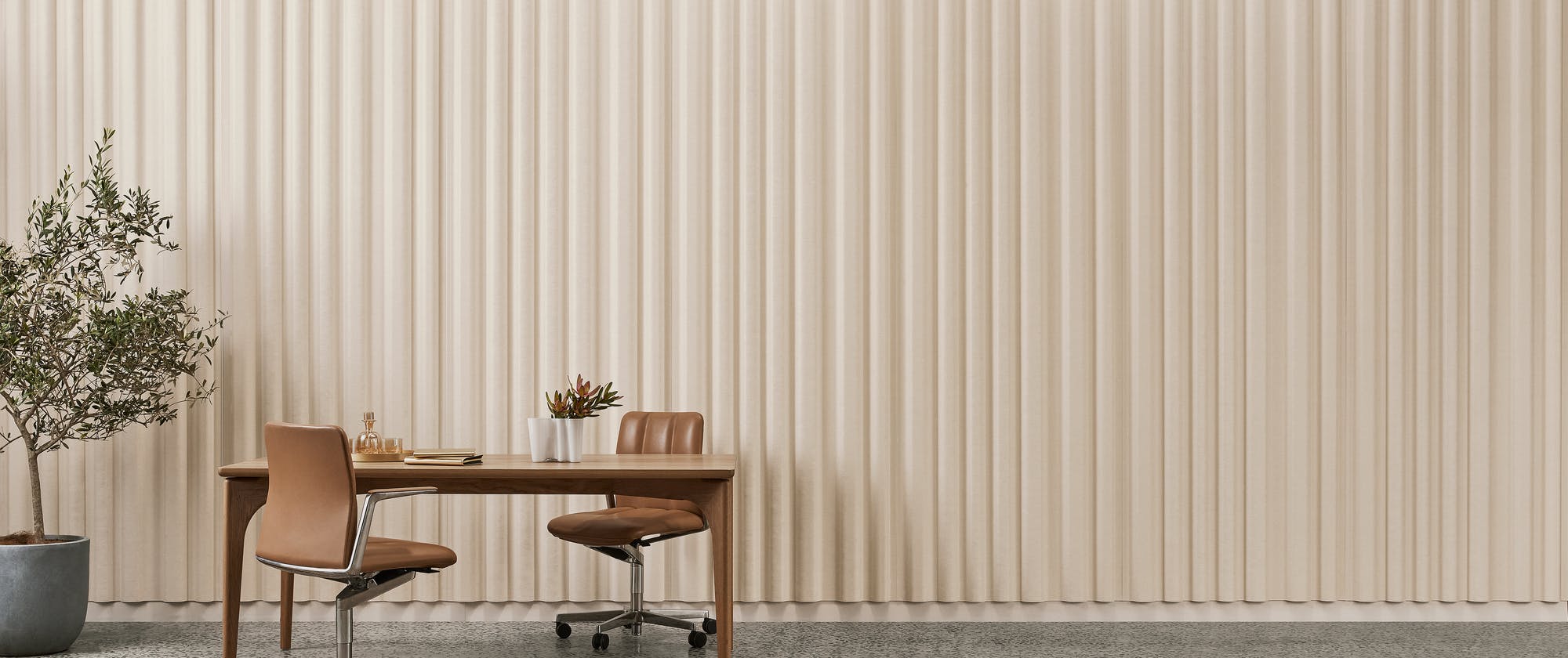 Wall with 3-D formed curtain acoustic panel that gives rippled appearance to the surface.