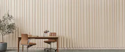 Wall with 3-D formed curtain acoustic panel that gives rippled appearance to the surface.