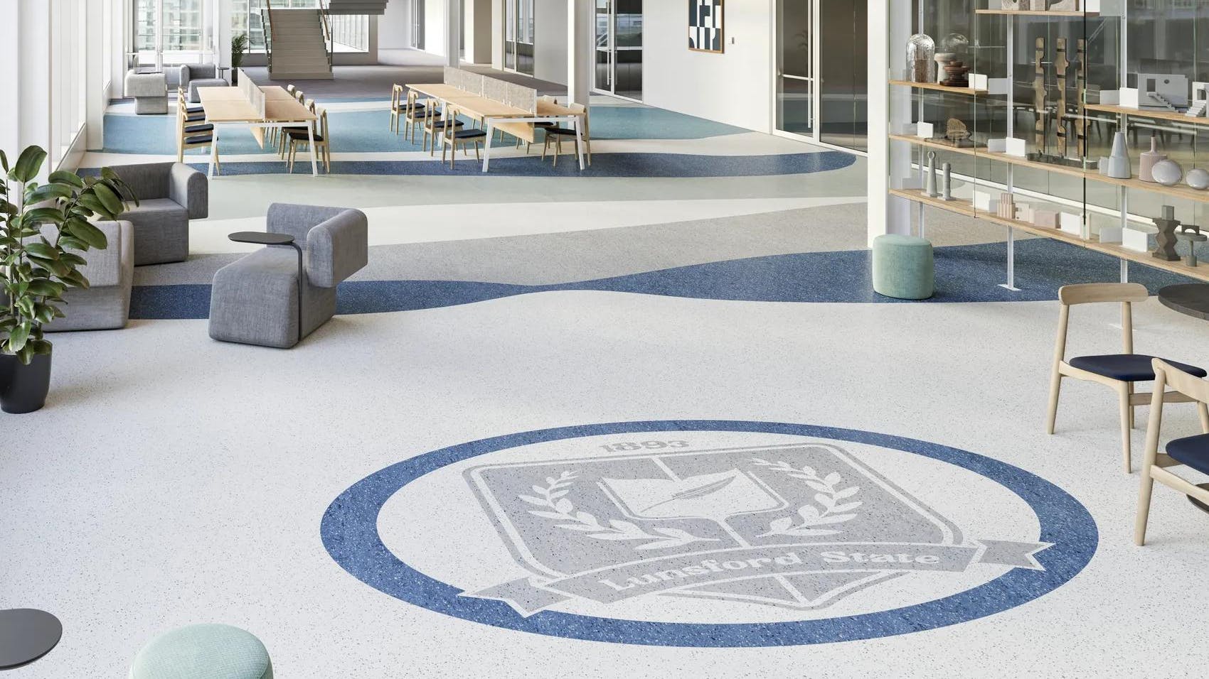 Interior with Johnsonite Pearla Rubber Tile flooring in white, blue, and grey that resembles terrazzo flooring.
