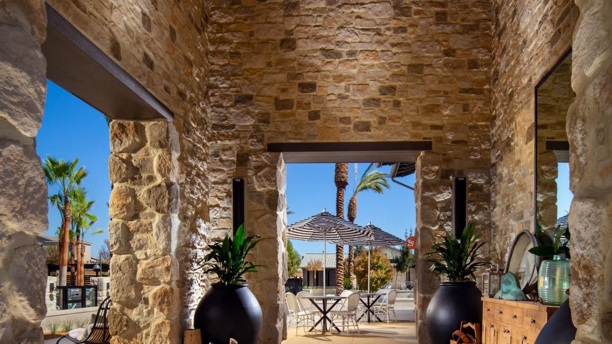 Interior/outdoor living space crafted in architectural stone veneer in Ranchers Ridge Roughcut.new colorway