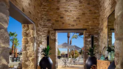 Interior/outdoor living space crafted in architectural stone veneer in Ranchers Ridge Roughcut.new colorway