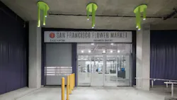 Sliding door and overhead coiling door in white and the signature purple of the San Francisco Flower Market.