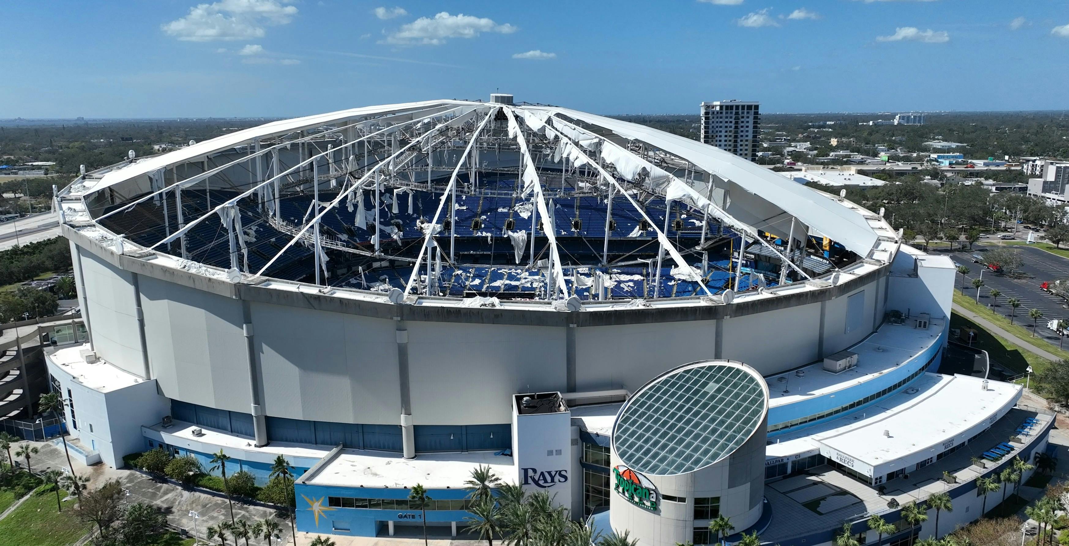 Damaged Tropicana Field roof showing shredded roof fabric and missing PTFE panels.