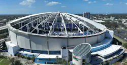 Damaged Tropicana Field roof showing shredded roof fabric and missing PTFE panels.