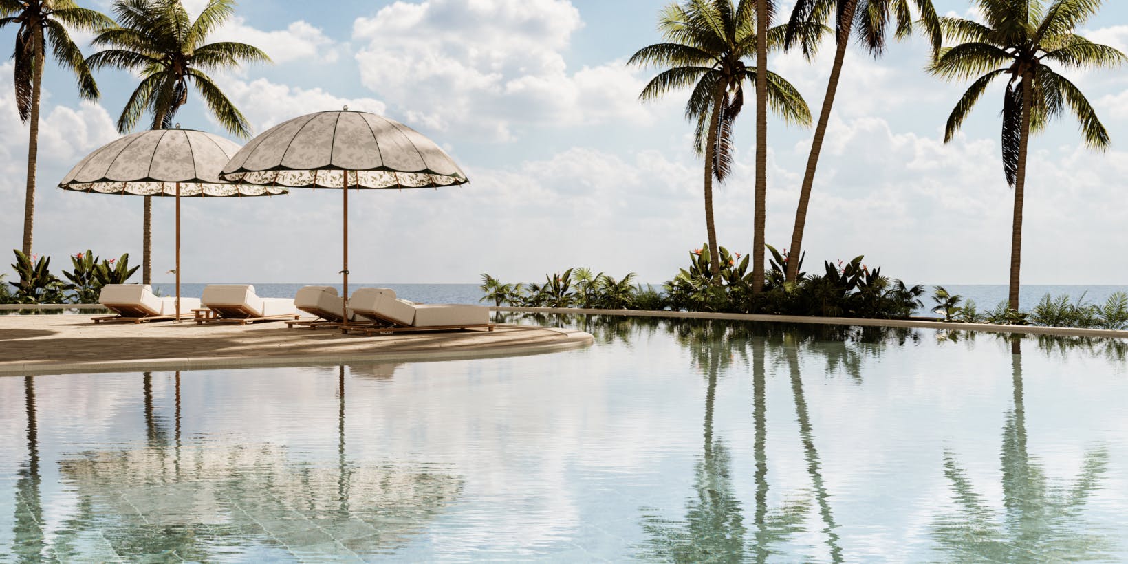 Poolside scene with palm trees and Marbella sun loungers under umbrella.