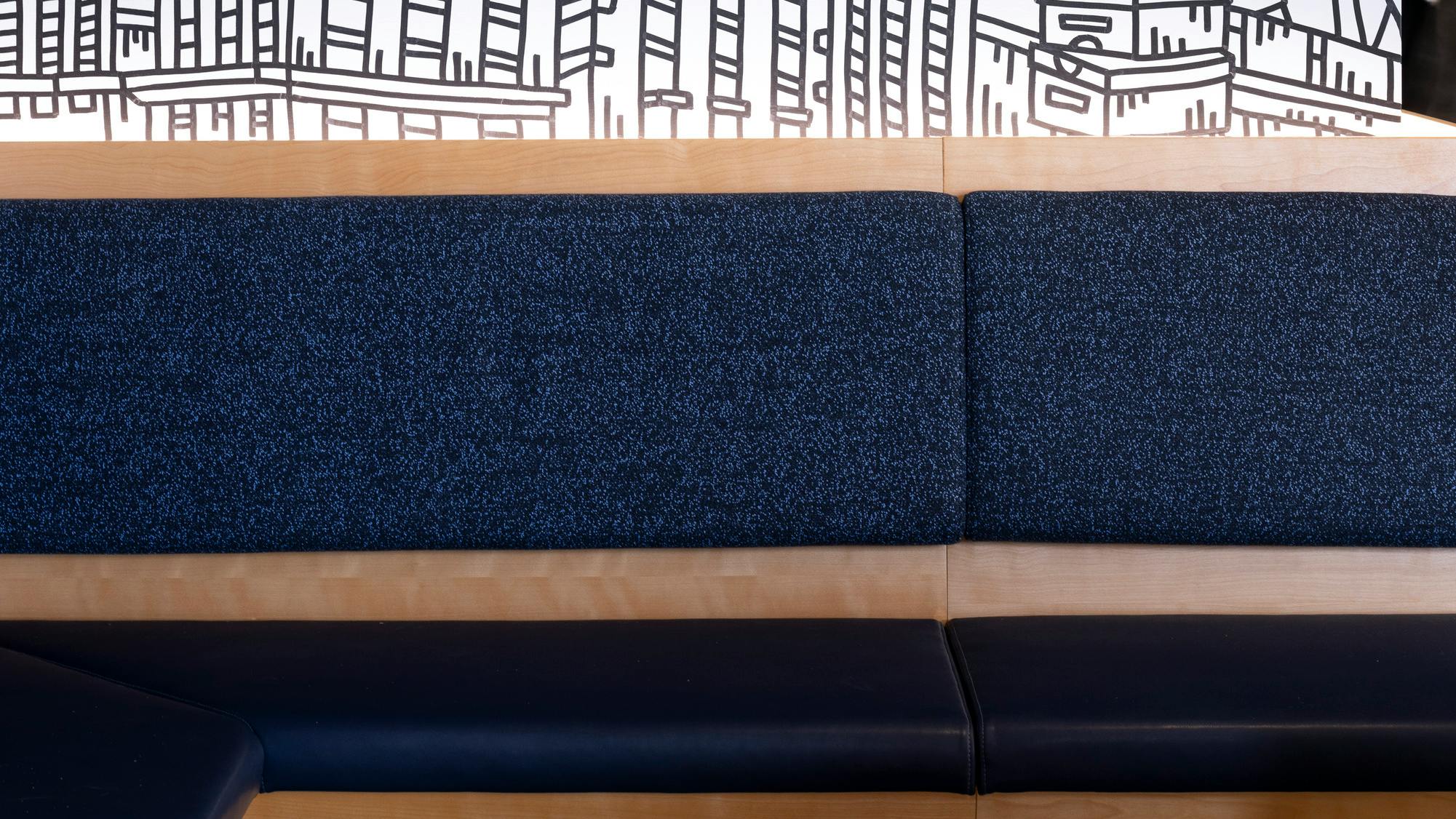 Banquet clad in Emergent Galaxy upholstery at the Brooks Running headquarters.