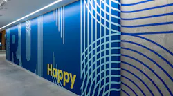 Branded wallcovering in Brooks signature blue from their headquarters.