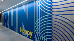 Branded wallcovering in Brooks signature blue from their headquarters.