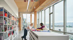 Material lab at Brooks Running headquarters with big windows and tunable white linear luminaire.