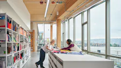 Material lab at Brooks Running headquarters with big windows and tunable white linear luminaire.