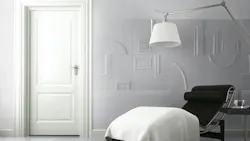 White wall with ornamental tiles of Frames Collection.