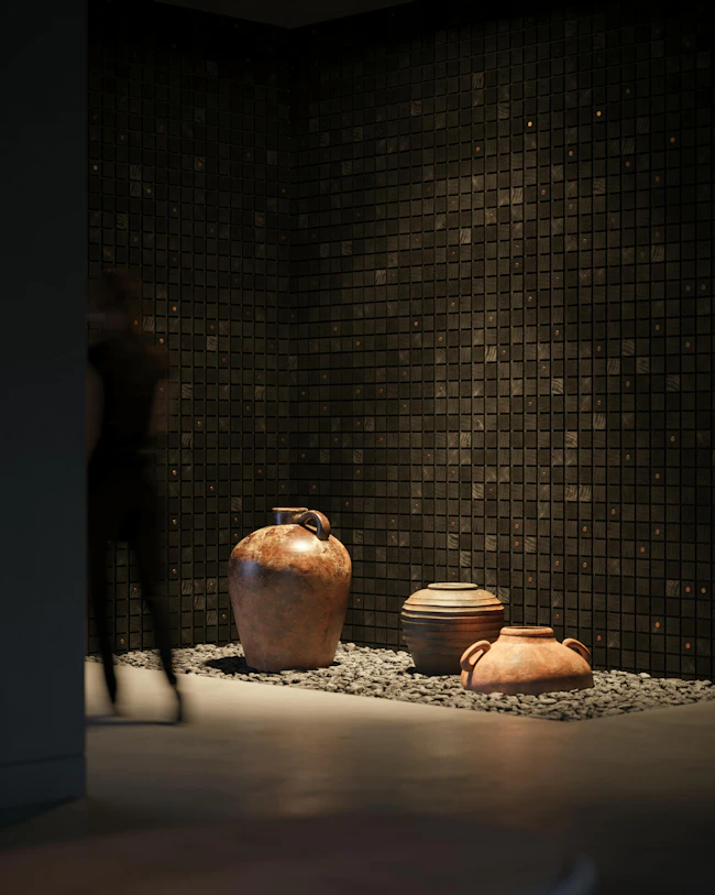 room with rocks, pottery, and sagrado wallcovering from WVH.