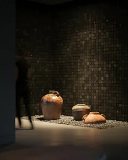 room with rocks, pottery, and sagrado wallcovering from WVH.