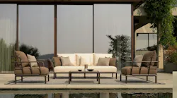 Sofa and two chairs placed poolside.