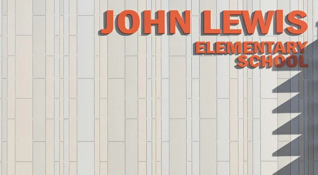 Exterior of John Lewis Elementary School showing oko skin panels in three widths in the color Sahara.